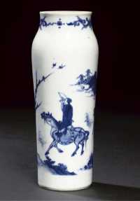A small blue and white sleeve vase